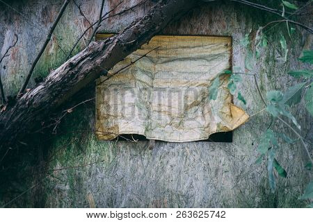 Old Abandoned Tree House With A Makeshift Window Deep In The Forest