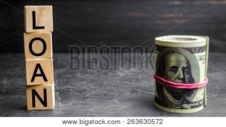 Money Dollars And Inscription On Wooden Blocks 
