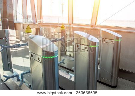 Business Executives Passing Through Turnstile Gate Office.