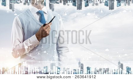 Double Exposure Of Confident And Young Businessman In Smart-casual Wear Smoking Pipe And Modern City