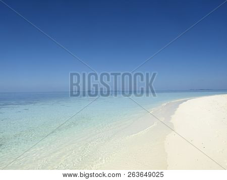 Maledivian Beach With White Sand And Blue Water