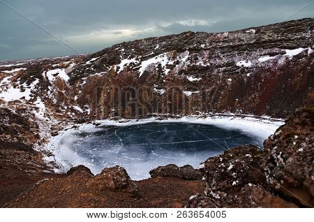 The Winter Colours Of Beautiful Kerio, Or Kerid Crater In Western Iceland. Red Volcanic Rock, Green 