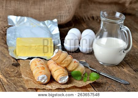Custard Tube Of Pastry Filled With Cream Traditional Czech Sweet, Butter, Eggs, Mint Leaves And Milk