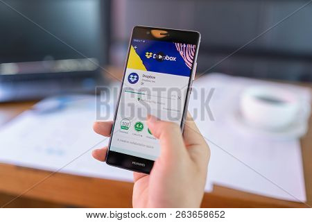 Chiang Mai, Thailand - May 06,2018: Man Holding Huawei With Dropbox On Screen. Dropbox Is A Service 