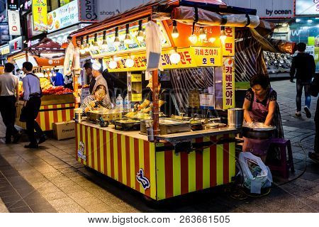 Suwon, South Korea - June 14, 2017: Adult Woman Enjoying Fast Food At The Main Street In Suwon.