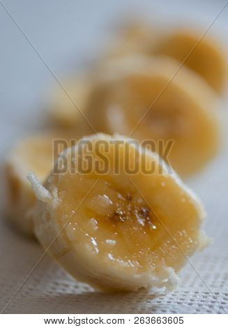 Neatly Sliced Juicy Banana On A Napkin, Dessert