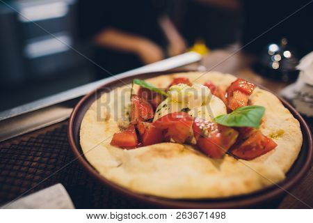 Turkish And Arabic Traditional Ramadan Pide With Egg On Top. Wood Background. Pizza Margherita Is A 