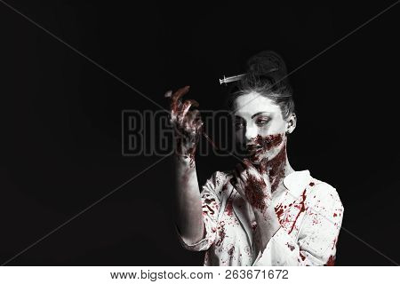 Scary Damaged Girl In Nurce Halloween Costume Looking Like Zombie