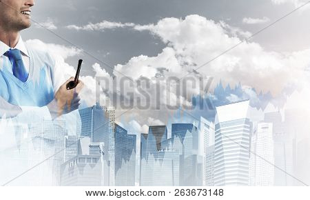 Double Exposure Of Confident And Young Businessman In Smart-casual Wear Smoking Pipe And Modern City