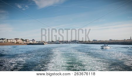 Small Fishing Boat Sailing At The Port Exit Of Saint Gilles Croix De Vie
