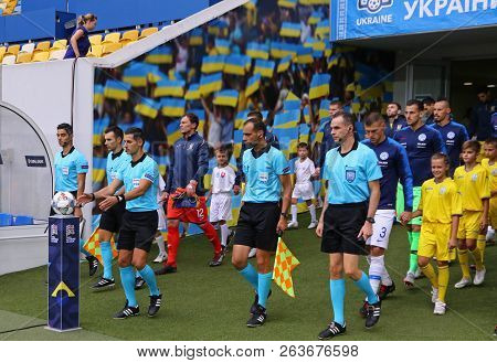Lviv, Ukraine - September 9, 2018: Referee Tasos Sidiropoulos (gre) Leads Players To The Pitch Of Ar