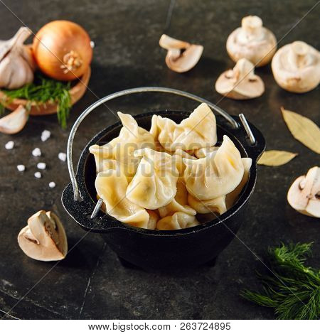 Dumplings with Blueberries. Berriesjiaozi, Dimsum, Momo or Ha Gao on Dark Background. Asian Food of Dough Based on Flour Stuffed with Meat, Fish, Vegetables, or Sweets