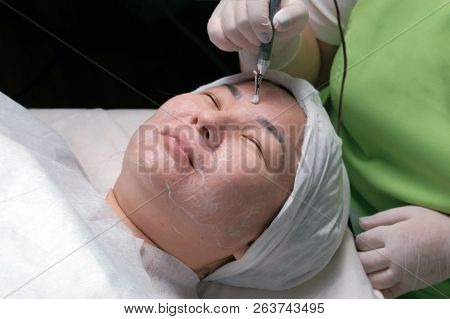 Hardware Cosmetology. Relaxed Muslim Woman With Eyes Closed During A Therapeutic Disincrustation Pro