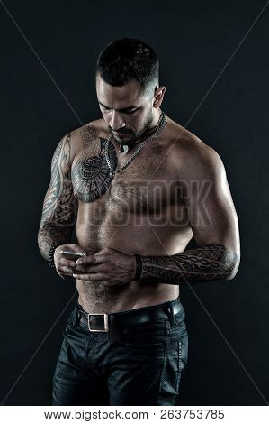 My Cell Phone Is My Best Friend. Man With Tattoo On Muscular Body. Muscular Man Use Mobile Phone. Ta
