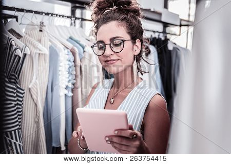 Fashionable Stylish Designer With Silver Nail Style Holding Her Pink Tablet
