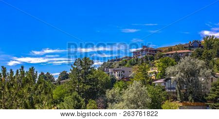 Homes On Hill Under Blue Sky In Salt Lake City