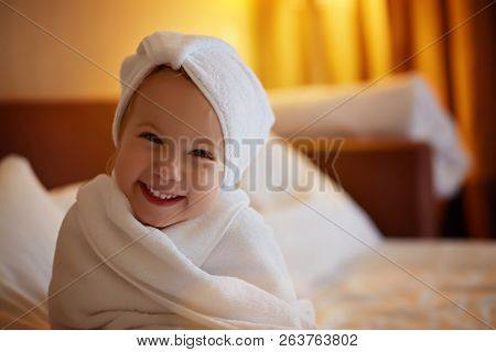 Happy Laughing Girl In Soft Bathrobe After Bath