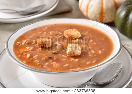 A Bowl Of Hearty Chicken Gumbo Soup With Vegetables And Rice
