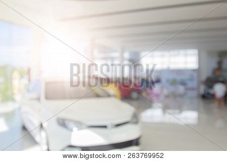 Blur Colorful Showroom A Row Of New Cars Parked At A Car Dealership Stock Customers To View And Buy.