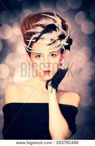 Redhead Girl With Rococo Hair Style At Vintage Background. Photo In Old Style.