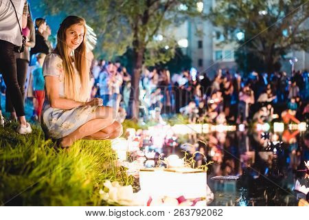 Young Womant With Chinese Lanterns Floating In Lake