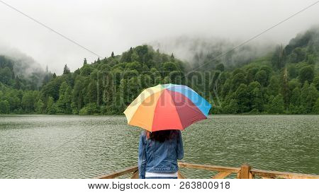 Artvin, Turkey - July 2018: An Unidentified Woman With Rainbow Color Umbrella By Borcka Karagol Natu