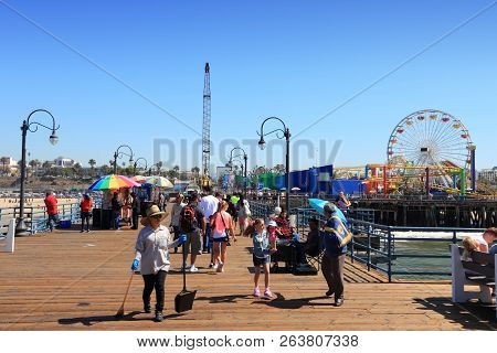 Santa Monica, United States - April 6, 2014: People Visit The Pier In Santa Monica, California. As O