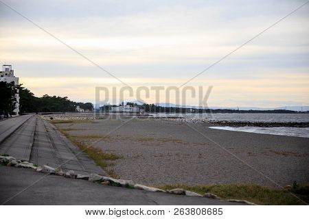Long Concrete Stairs Leading To Sand Beach On Japanese Coast