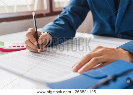 Business And Finance Investment Concept : Businessman Check About Cost And Doing Finance Graph Repor