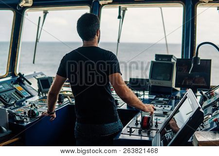 Marine Navigational Officer Is Maneuvering Ship Or Vessel