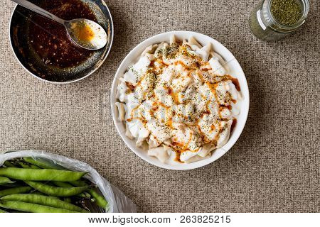 Turkish Manti Manlama / Ravioli With Yogurt And Fried Butter Sauce. Copy Space.