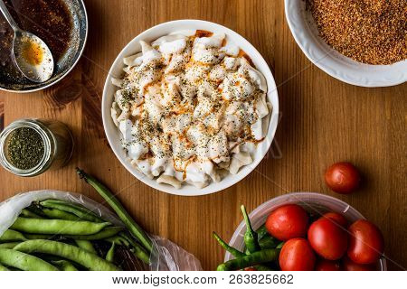 Turkish Manti Manlama / Ravioli With Yogurt And Fried Butter Sauce.
