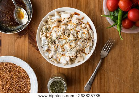 Turkish Manti Manlama / Ravioli With Yogurt And Fried Butter Sauce.