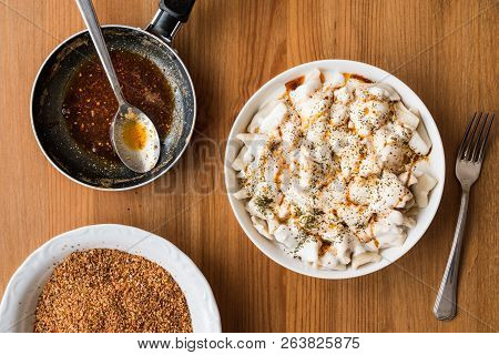Turkish Manti Manlama / Ravioli With Yogurt And Fried Butter Sauce.