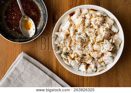 Turkish Manti Manlama / Ravioli With Yogurt And Fried Butter Sauce.