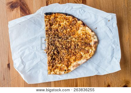 Half Lahmacun With Walnut Or Turkish Pizza Slice On Wooden Surface.