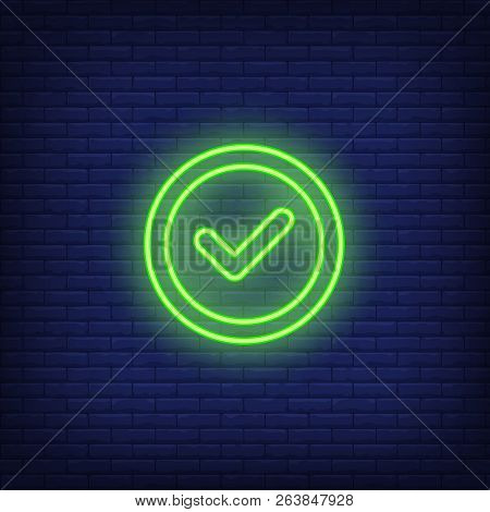 Check Mark Round Neon Sign. Glowing Neon Green Check Mark In Circle On Dark Blue Brick Background. V