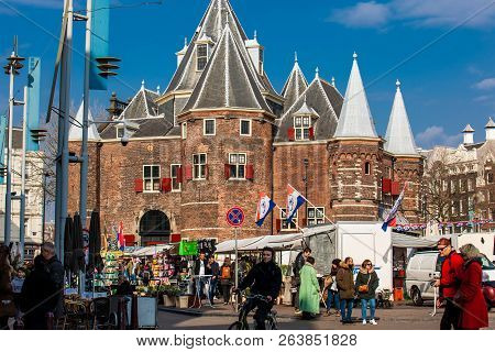 Amsterdam, Netherlands - March, 2018: The Nieuwmarkt Square Daily General Goods Market In The Old Ce