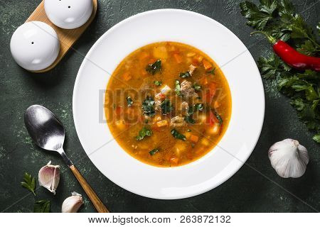 Traditional Hungarian Goulash Soup On The Table. European Cuisine. Top View.