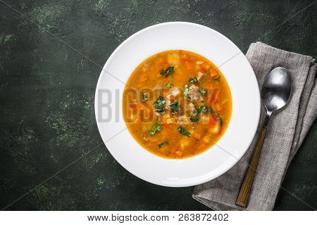 Traditional Hungarian Goulash Soup On The Table. European Cuisine. Top View With Copy Space.