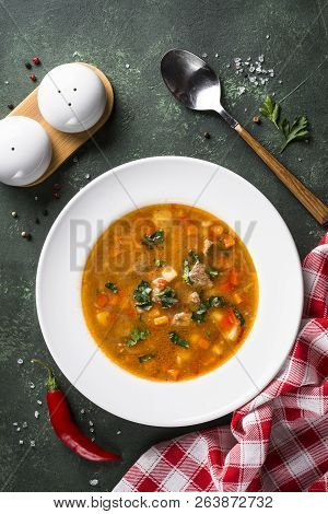 Traditional Hungarian Goulash Soup On The Table. European Cuisine. Top View With Copy Space, Vertica