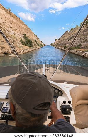 Captain Controls The Boat During The Passage Through The Corinth Canal Summer Morning, 2018.