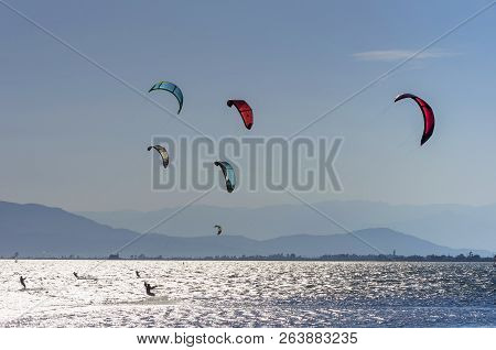 Kite Surfers On Riding Waves On Mediterranean Sea