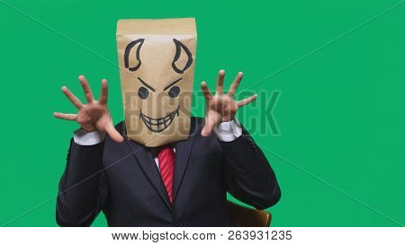 Concept Of Emotion, Gestures. A Man With A Package On His Head, With A Painted Smiley Angry, Sly, Gl