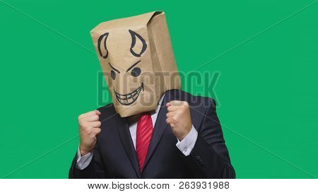 Concept Of Emotion, Gestures. A Man With A Package On His Head, With A Painted Smiley Angry, Sly, Gl