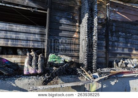 Close Up Damaged Industry Supermarket Metallic Facade After Arson Fire With Burn Debris Of Plastic B