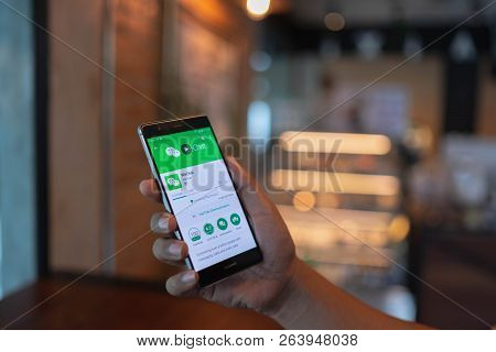 Chiang Mai, Thailand - June 09,2018: Man Holding Huawei With Wechat  On The Screen.wechat Is A Chine