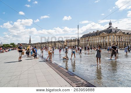 Bordeaux, France - July 22, 2018: People Enjoying On The Water Mirror. Located Across From Place De 