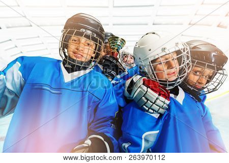 Childrens Ice Hockey Team Celebrating Victory Together