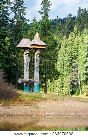 Synevyr, Ukraine - Oct 19 2013: Statue Of Syn And Vyr On The Shore Of A Lake In Forest